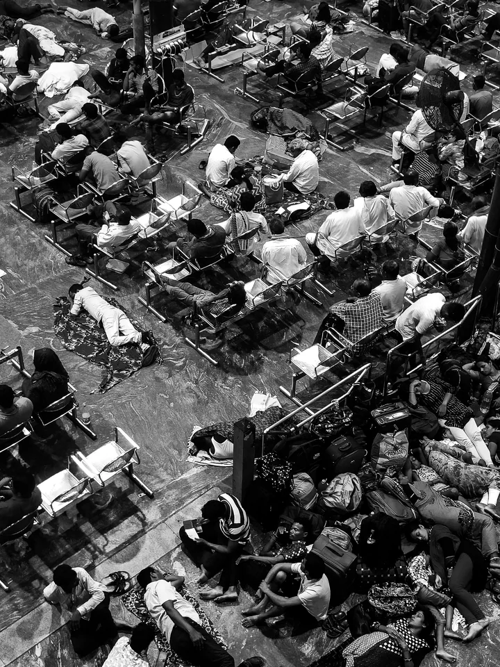 A closer look into the crowd from above, every figure part of a larger pattern.