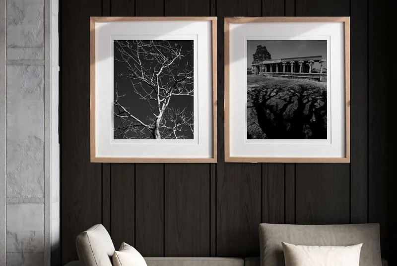 A pair in pale wood: Matched wood frames with deep mounts on dark panelling.
